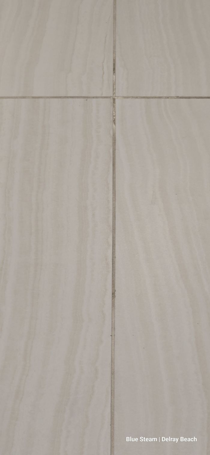 Close-up of clean, natural tile grout lines before any color sealing